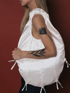 studio lamea drawstring bag white adjustable size white shoulder bag sustainable finnish design womens white handbags made from luxurious deadstock materials